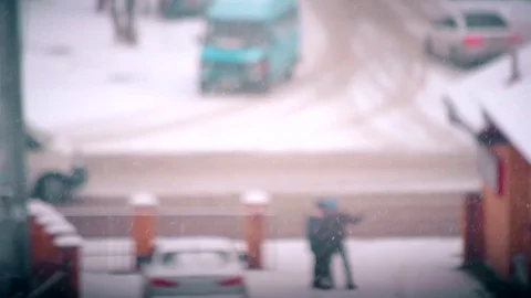 Snow falling on blurred city road landscape background Stock Footage 74753003