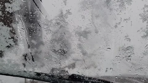 Snow falling on the car windscreen Stock Footage 280637362