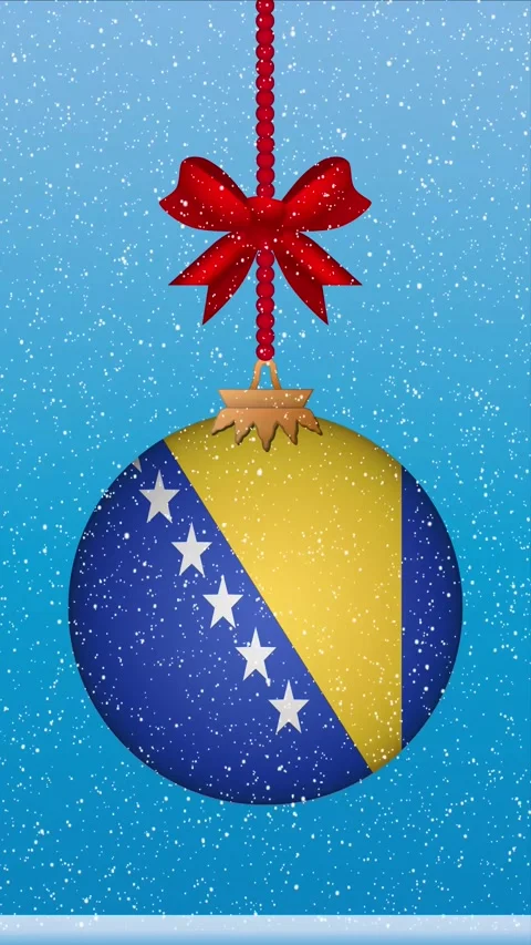 Snow falling on christmas ball with flag of Bosnia and Herzegovina Stock Footage 247674063