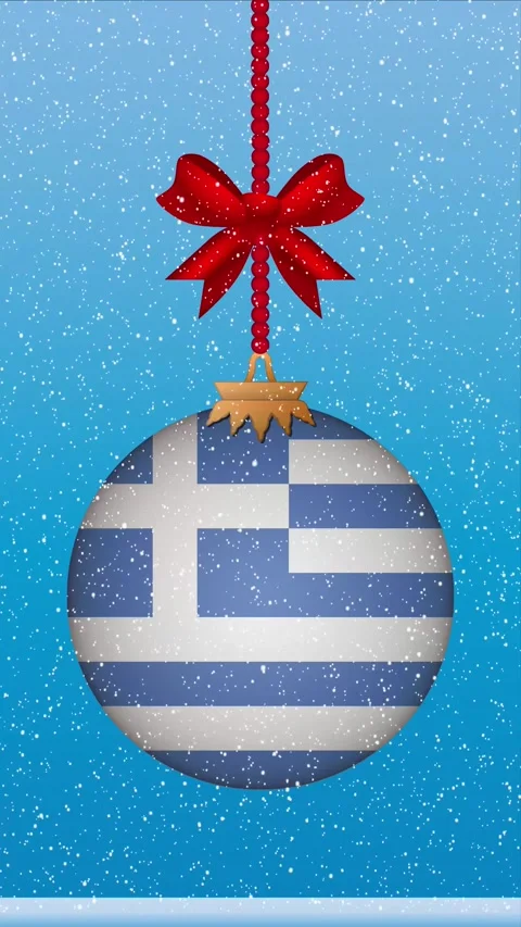Snow falling on christmas ball with flag of Greece Stock Footage 248315173