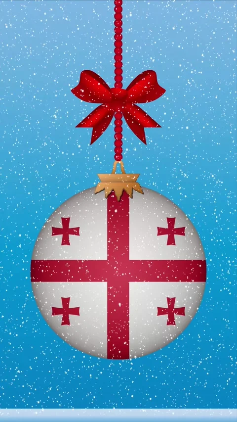 Snow falling on christmas ball with flag of Georgia Stock Footage 248315195