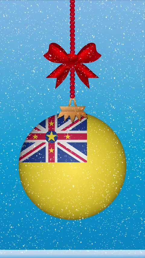Snow falling on christmas ball with flag of Niue Stock Footage 248442013