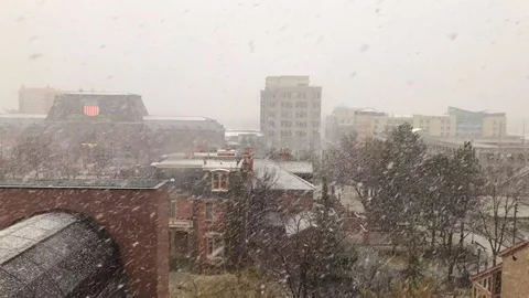 Snow falling in the City Stock Footage 117938816
