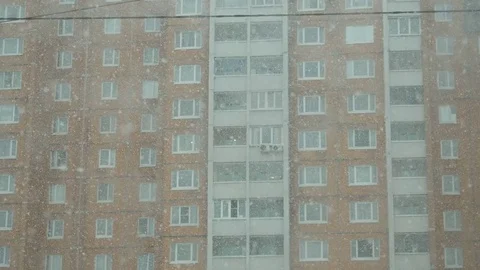 Snow falling in city, winter background. Snowstorm, snowy weather. Stock Footage 74729890