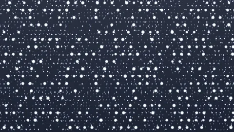 Snow falling on a dark background creating a winter scene Stock Footage 338288179