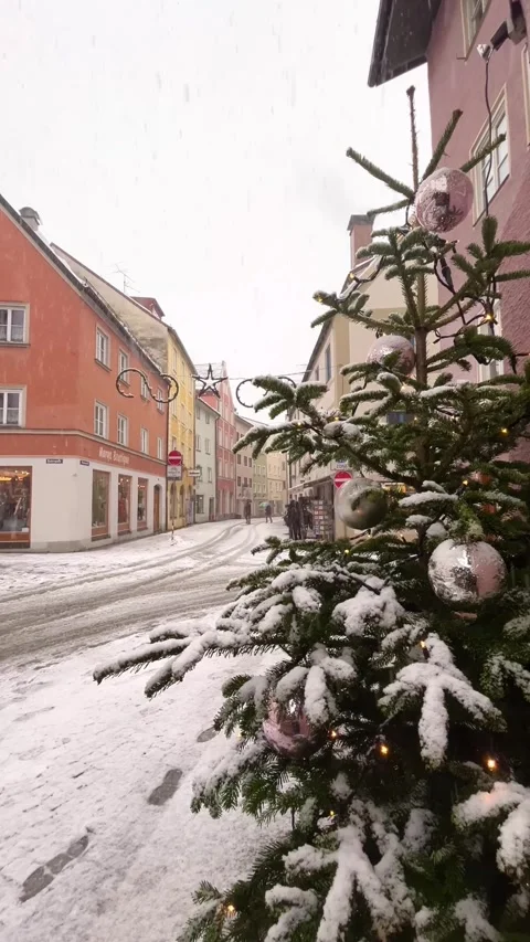 Snow falling on a decorated Christmas tree in Füssen, Germany Stock Footage 346272966