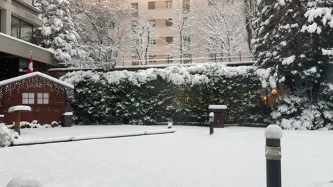 Snow falling down over a Swiss chalet Stock Footage 262669909