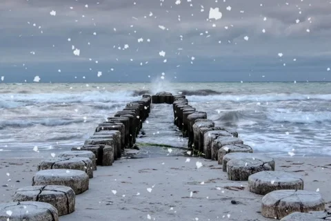 Snow is falling on the edge of the sea Stock Footage 203072085