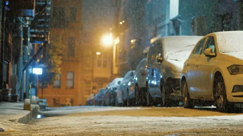 Snow falling at empty backstreet, street with no people at night during snowfall Stock Footage 219498221