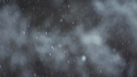 Snow falling in focus with mottled background Stock Footage 102180550