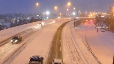 Snow falling on freeway Stock Footage 103870584