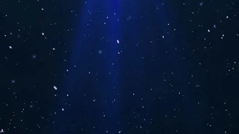 Snow falling gently against dark blue background with spotlight Stock Footage 327516760