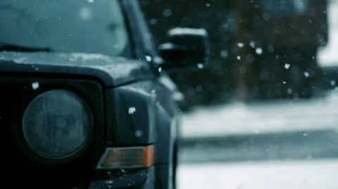 Snow Falling on the hood and side mirror of a Jeep Patriot, Slow Motion, Medium Stock-Footage 59932798