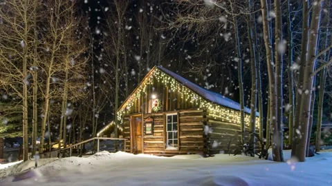 Snow Falling on Log Cabin Frisco Colorado Stock Footage