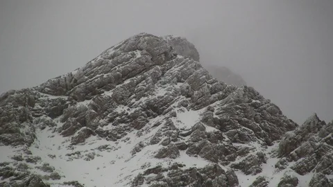 Snow Falling on Mountain Peak Stock Footage 107441851