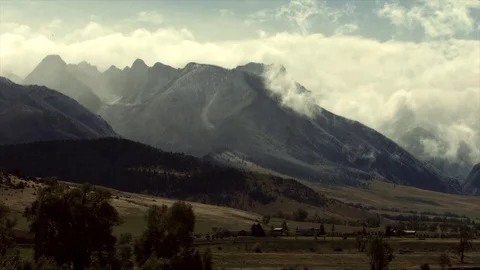 Snow falling on the mountains just outside of Yellowstone National Park Stock Footage 94839203