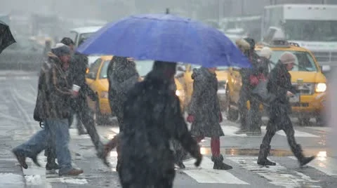 Snow falling in New York City crowd walking 30p Stock Footage