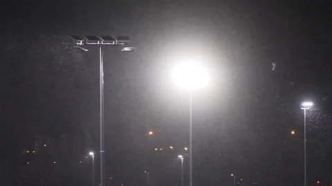 Snow falling at night shot in slow motion. winter season bad weather storm Stock Footage 81720185