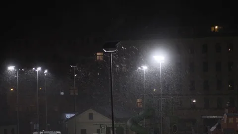 Snow falling at night shot in slow motion. winter season bad weather storm Stock Footage 81720448