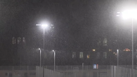 Snow falling at night shot in slow motion. winter season bad weather storm Stock Footage 81720623