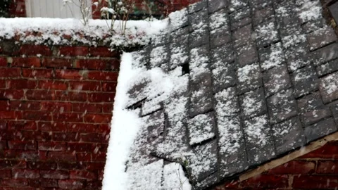 Snow Falling On A Old Broken Slate Roof 스톡 동영상 148222499