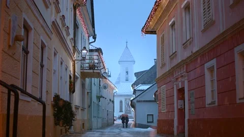 Snow falling in old medieval town Kranj, Slovenia Stock Footage 146171719