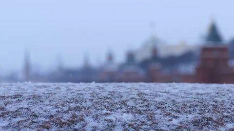 Snow Falling with Out of Focus Buildings Stock Footage 76844150