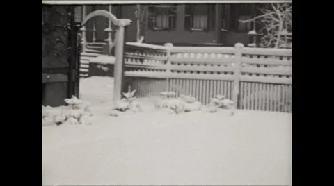 Snow falling outside of home 1930 Video stock 56160941