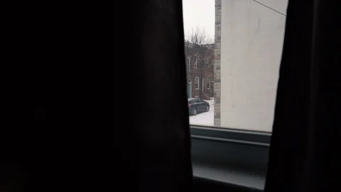 Snow falling outside window in city Stock Footage 102236941