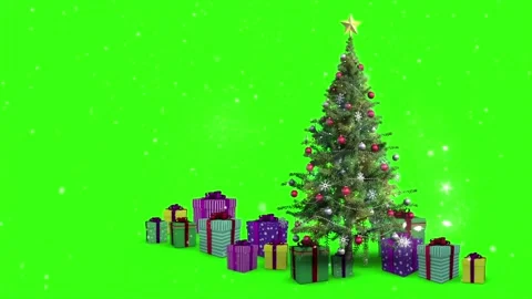 Snow falling over Christmas tree and gift boxes on green screen background Stock Footage 320622991