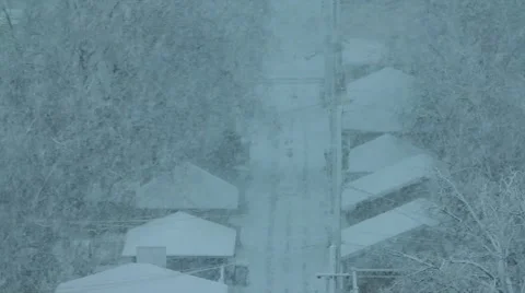 Snow falling over houses Video stock 48366741