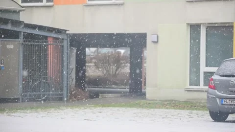 Snow Falling Over A Parked Car And Apartment Building Stock Footage 343447498