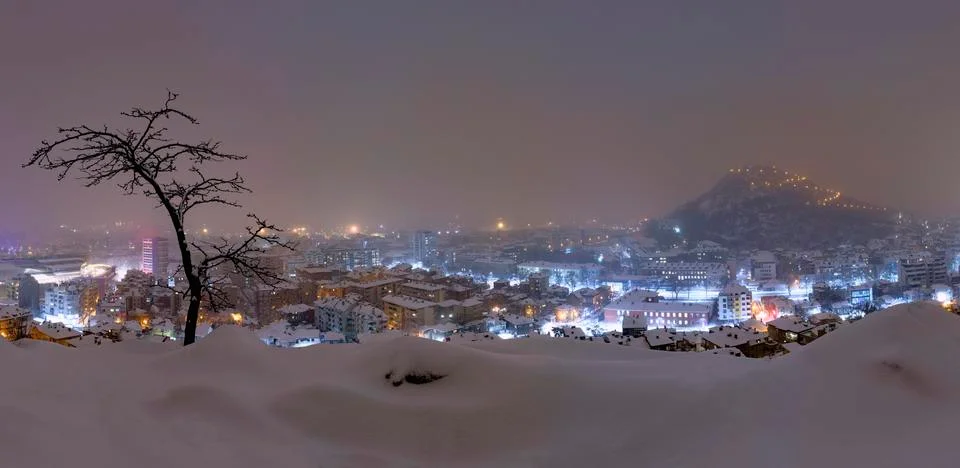 Snow falling over Plovdiv city, Bulgaria Stock Photos