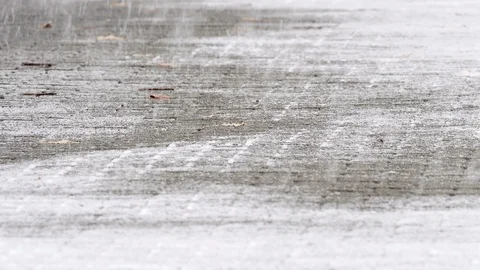 Snow falling over a sidewalk Stock Footage 120781659