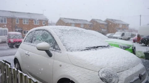 Snow Falling On Parked White Car Stock Footage 145921574