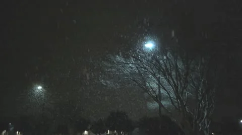 Snow falling in parking lot 1 Stock Footage