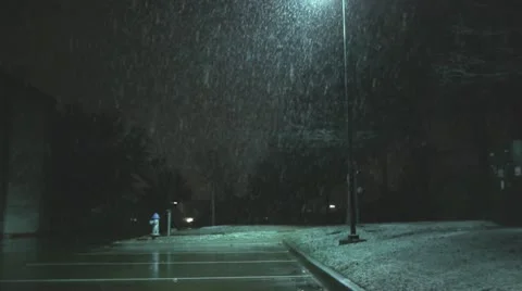 Snow falling in parking lot 2 Video stock 10884953