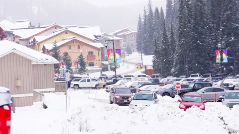 Snow falling on parking in Sun Peaks skiing resort, BC, Canada, Dec, 2020 Stock Footage 147066258
