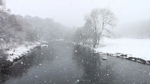 Snow Falling on the River Tees in Upper Teesdale County Durham UK Stock Footage 114892586