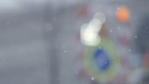 Snow Falling. Road Works on Background. Slow-Mo. 動画素材 87247051