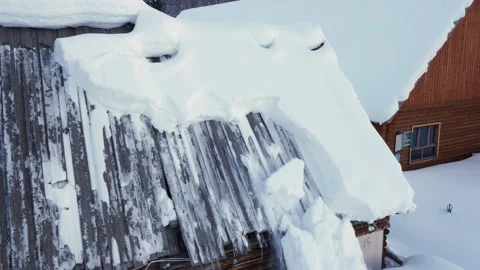 Snow falling from the roof Stock Footage 235109907
