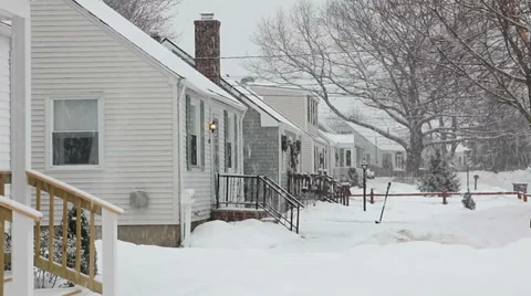 Snow falling on a row of houses 스톡 동영상 33745367