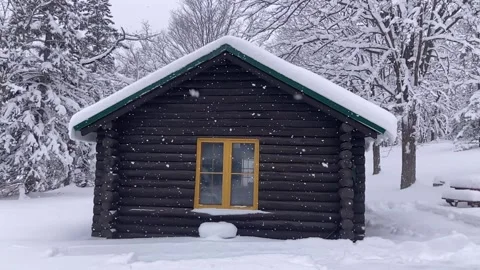 Snow falling slow motion at log cabin Stock Footage 227425159