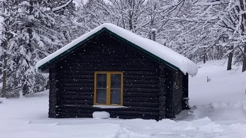 Snow falling at small cabin slow motion Stock Footage 227425459