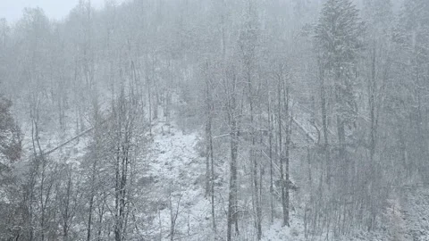 Snow falling on steep mountain slope area in countryside Stock Footage 144473649