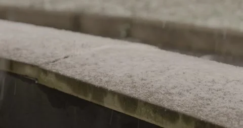 Snow falling on stone wall Stock Footage 147655279