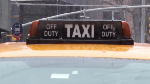 Snow Falling on a Taxi Stock Footage 35517589