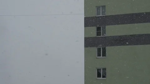 Snow falling in town, winter background. Snowstorm, snowy weather. Video stock 74873263