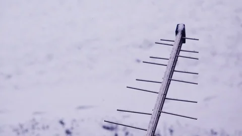 Snow falling on TV antenna Stock-Footage 71571524
