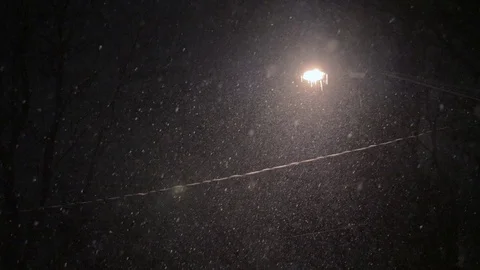 Snow Falling Under Street Lamp At Night 库存影片 72650845